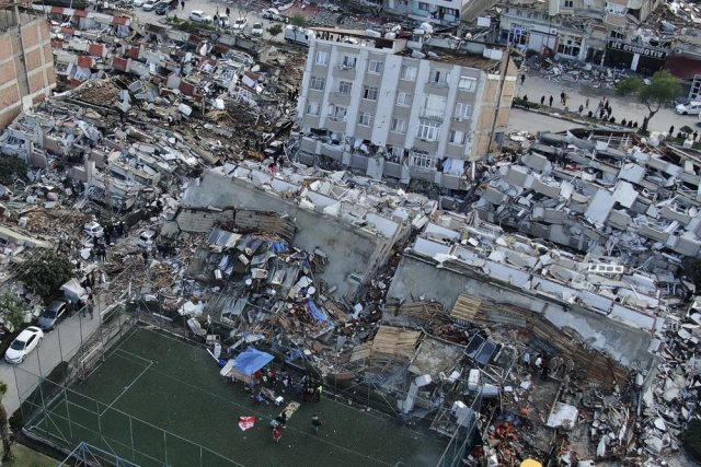 Rescue workers search through rubble of collapsed buildings in a Turkish city after a devastating earthquake.