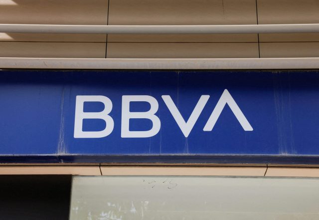 Madrid’s Ciudad BBVA towers loom under grey skies as investigators enter the lobby amid a criminal spying probe.