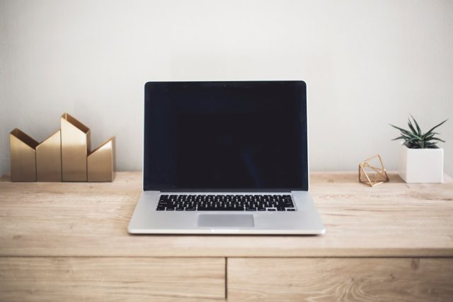 Rob Leathern, Facebook product director, types on a laptop in a modern office setting.