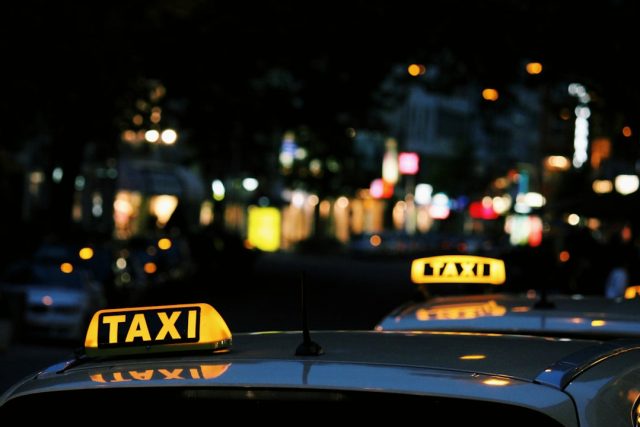 Ola launches in London with 20,000 drivers and zero-commission offer Ola ride-hailing app interface on a smartphone with London black cabs in the background