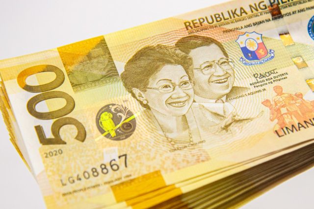 Fitch Ratings logo overlays Manila skyline with new infrastructure projects under construction