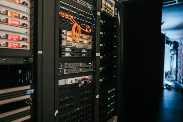 A person interacts with a GPT-4V interface analyzing a photograph on a screen, demonstrating the model's image-processing capability.
