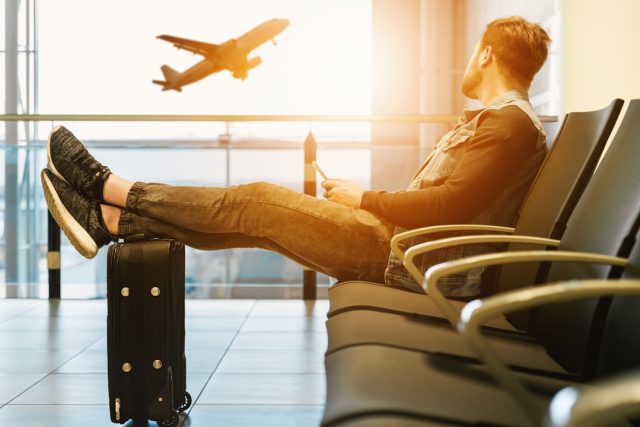 Empty passenger jet on tarmac with airline crew preparing for repatriation flight during pandemic