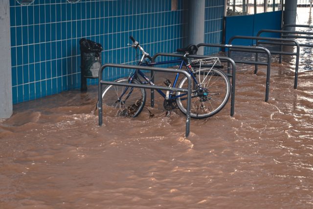 Brown floodwater covers streets and homes in northern Honduras as slow-moving Tropical Storm Sara dumps relentless rain overhead.