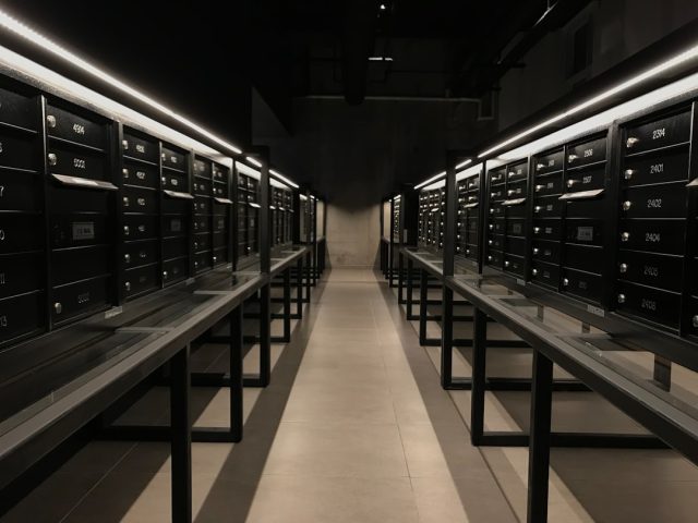 Rows of server racks glow as engineers monitor DeepSeek's low-cost AI training cluster in a Beijing lab.