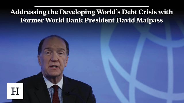 World Bank President David Malpass speaking at a podium, urging lawmakers to address rising debt levels.