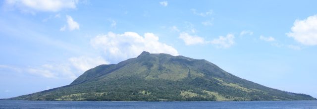 Aerial view of Ruang volcano erupting, spewing ash and gas over the small island in North Sulawesi, Indonesia.