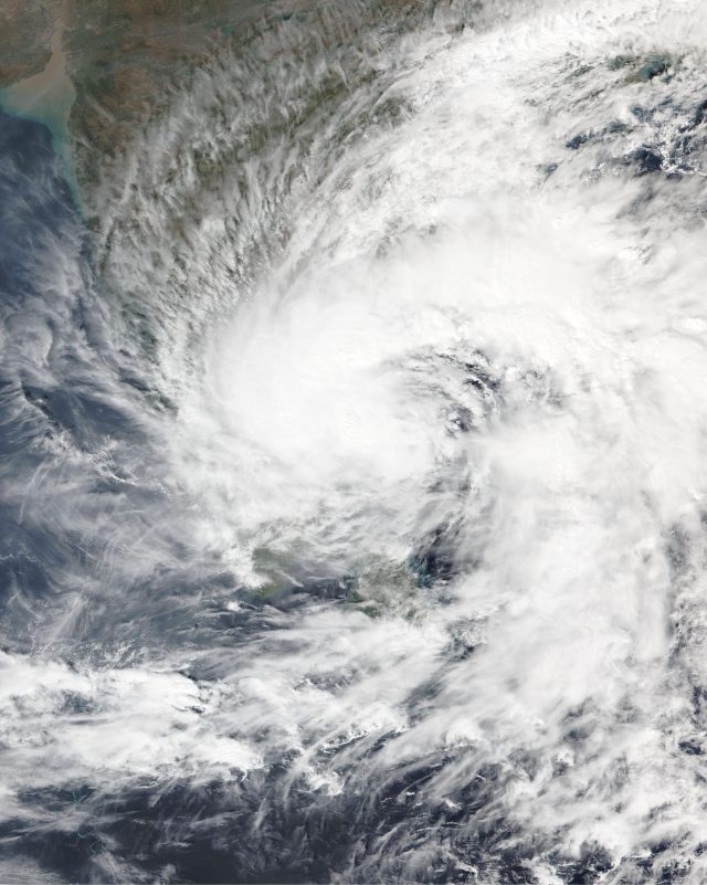 Flooded streets and damaged homes in a coastal town after Cyclone Fengal struck Southern India and Sri Lanka.