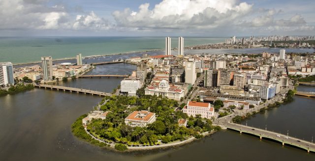 Apartment Building Collapse in Brazil Kills 14, Injures Several Others Rescuers search through rubble of a collapsed apartment building in Recife, Brazil, amid dust and debris.