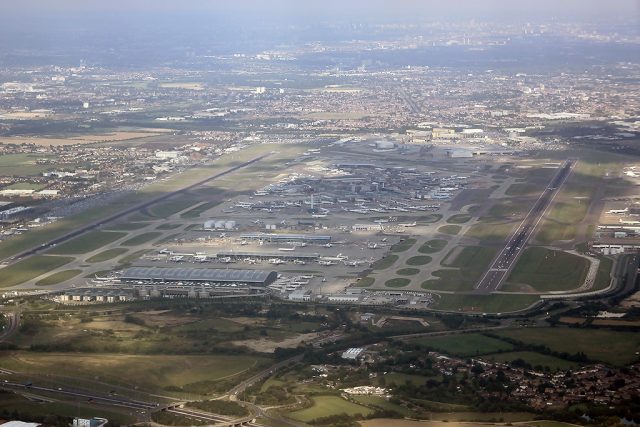 Heathrow Airport terminal empty and dark as flights are canceled due to a power outage from a nearby substation fire.