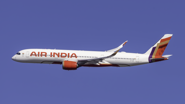 Wreckage of an Air India Boeing 787 Dreamliner scattered near Ahmedabad Airport with emergency responders at the scene.