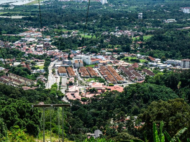 Van accident in Malaysia leaves one dead, ten injured in Penang gorge A damaged tourist van lies at the bottom of a steep gorge in Balik Pulau, Penang, surrounded by emergency responders.