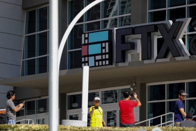 Ftx Bankruptcy Bahamas November 2022 Empty FTX trading floor desks lit by blue screens as staff exit after bankruptcy filing