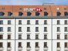 HSBC Pays €294M to Settle Belgian Tax Evasion Probe HSBC logo outside a glass office tower as Belgian justice officials announce the 2019 settlement.