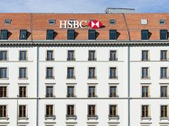HSBC Pays €294M to Settle Belgian Tax Evasion Probe HSBC logo outside a glass office tower as Belgian justice officials announce the 2019 settlement.