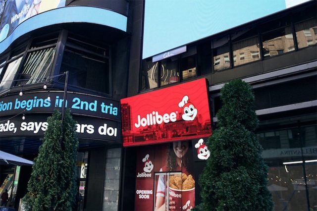 Jollibee Times Square New York Jollibee fast-food restaurant exterior with customers entering and exiting the building.
