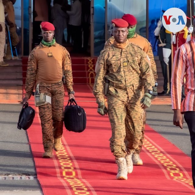 Captain Ibrahim Traoré stands with soldiers in a military setting after seizing power in Burkina Faso.