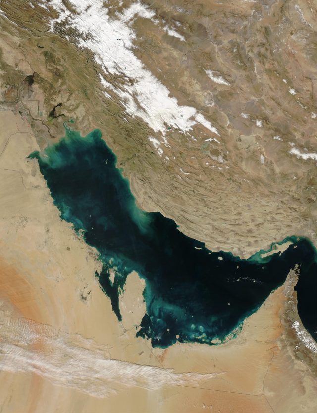 Partially redacted U.S. military MISREP form displayed on screen with Persian Gulf map in background.