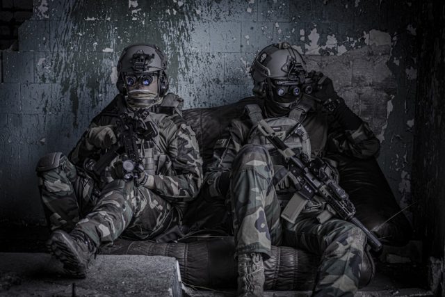 Two UN peacekeepers in blue helmets recover from injuries at a damaged watchtower headquarters in southern Lebanon.