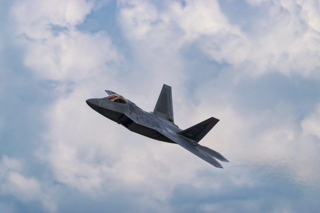 Boeing engineers examine a classified sixth-generation fighter jet design in a secure hangar.