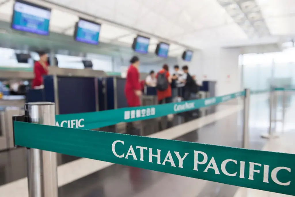 Cathay Pacific aircraft parked at Hong Kong International Airport with reduced flight activity visible on the tarmac.