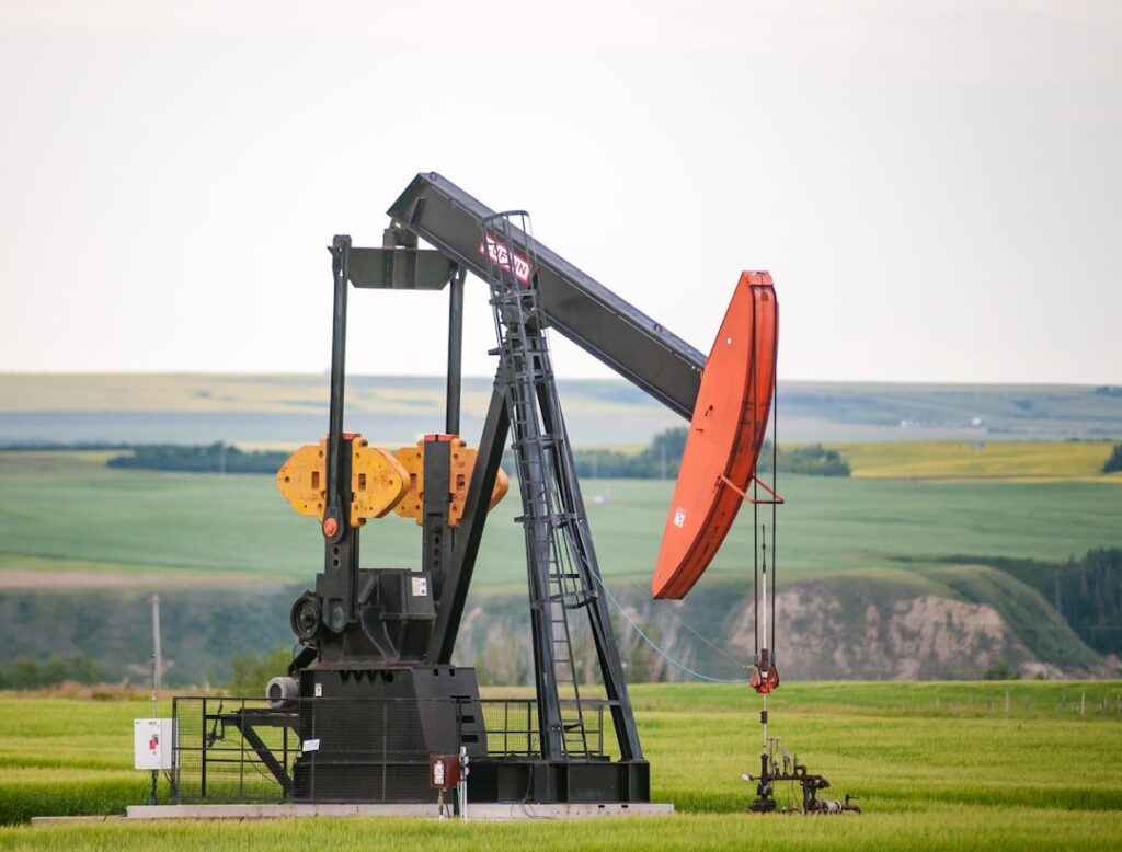 A trading desk screen shows Brent crude prices plummeting 22 percent as traders react to Saudi Arabia's surprise output increase.