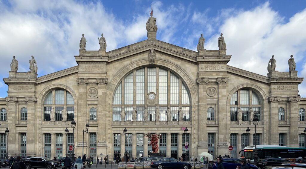 Bomb disposal experts assess a large unexploded ordnance near railway tracks at Gare du Nord station in Paris.