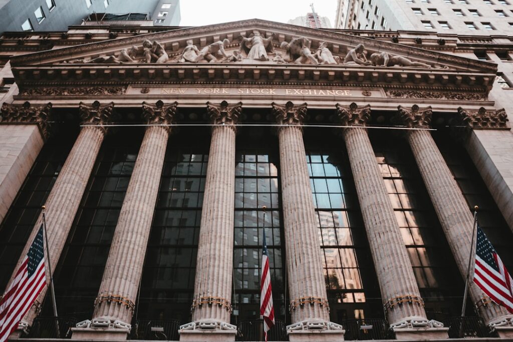 Traders watch Federal Reserve boardroom screens showing steady rate decision odds rising to 75%