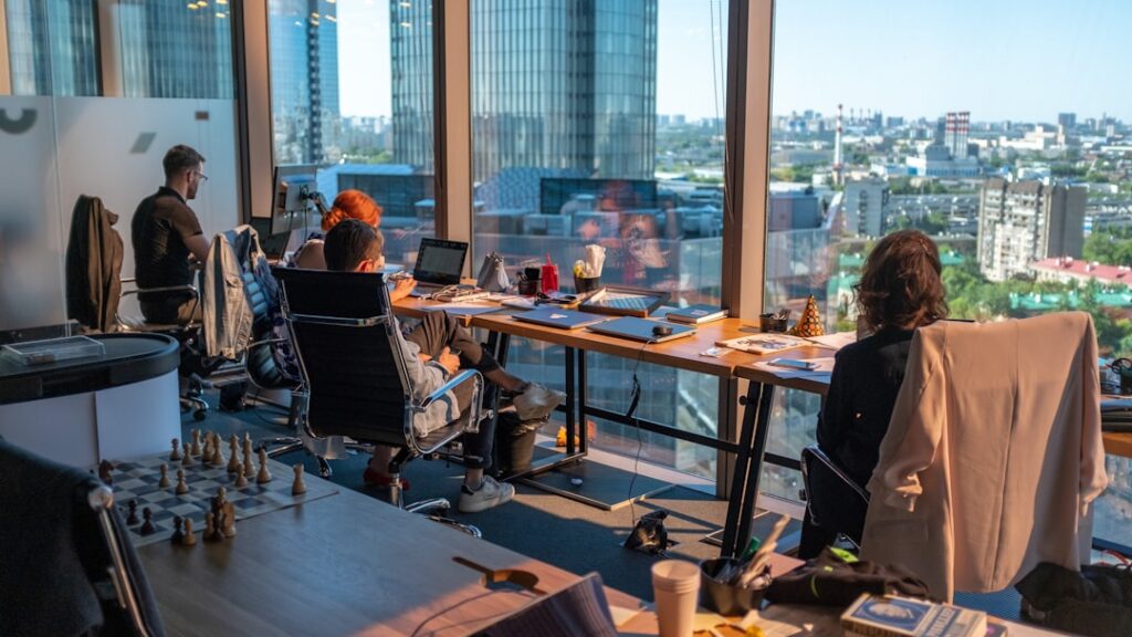 YU KUAN CHON and YU KUAN HUAT overseeing a boardroom meeting at ALX Assets Berhad headquarters.